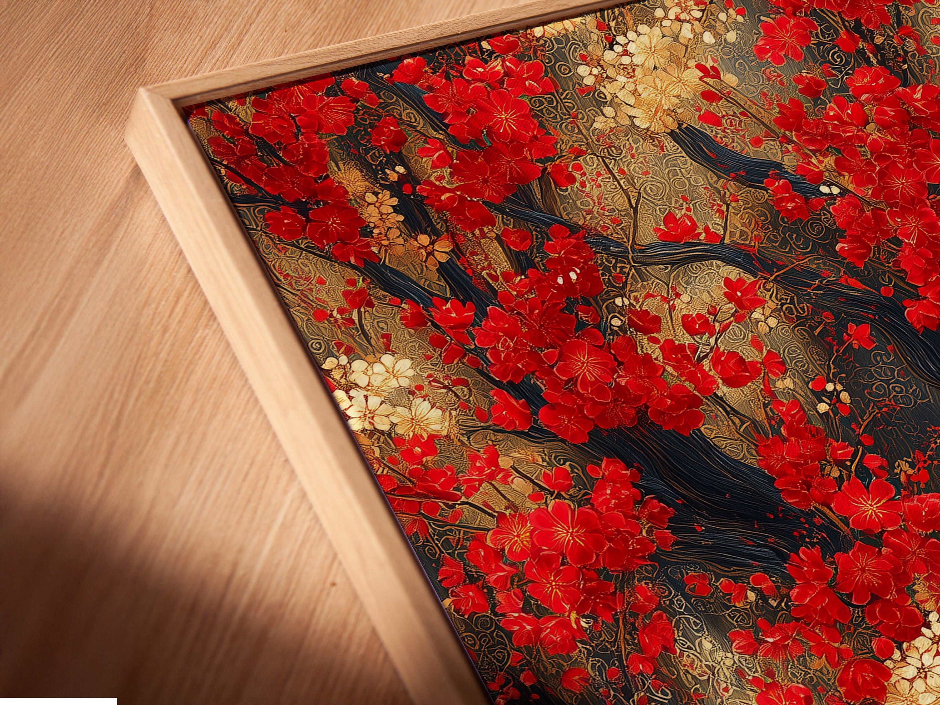 A close-up angled view reveals a Red Blossoms Canvas Print in a floating frame. The Japanese cherry tree wall art adds Asian botanical elegance to your home. This red floral canvas is perfect for contemporary wall decor. The artwork features red and gold accents. It is ideal for modern spaces.