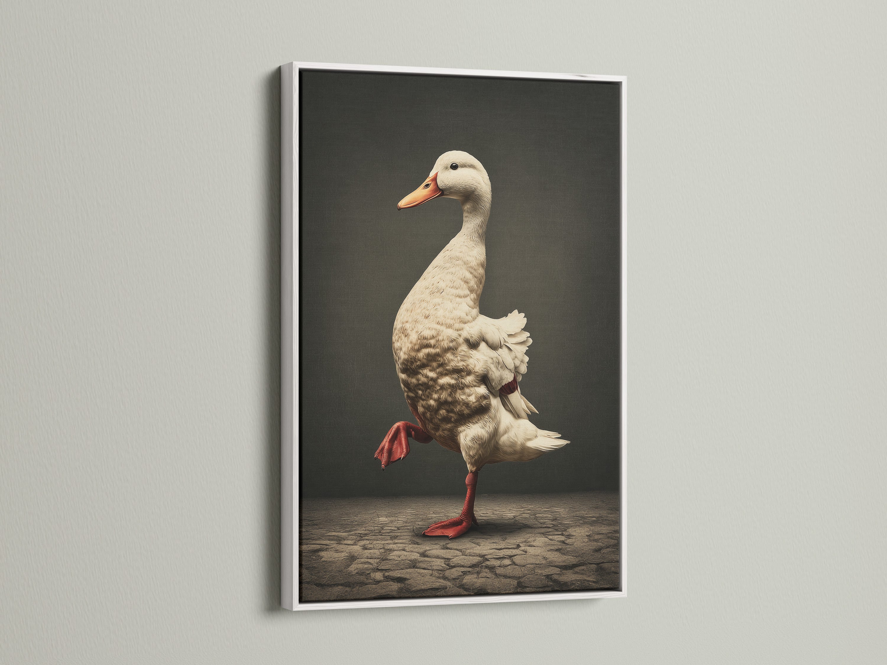 Vintage Duck Canvas Artwork in a white frame. This whimsical farmhouse artwork features a duck wearing red boots. The white frame adds a clean touch. Perfect for kitchen wall decor or country wall decor. It complements vintage styles.
