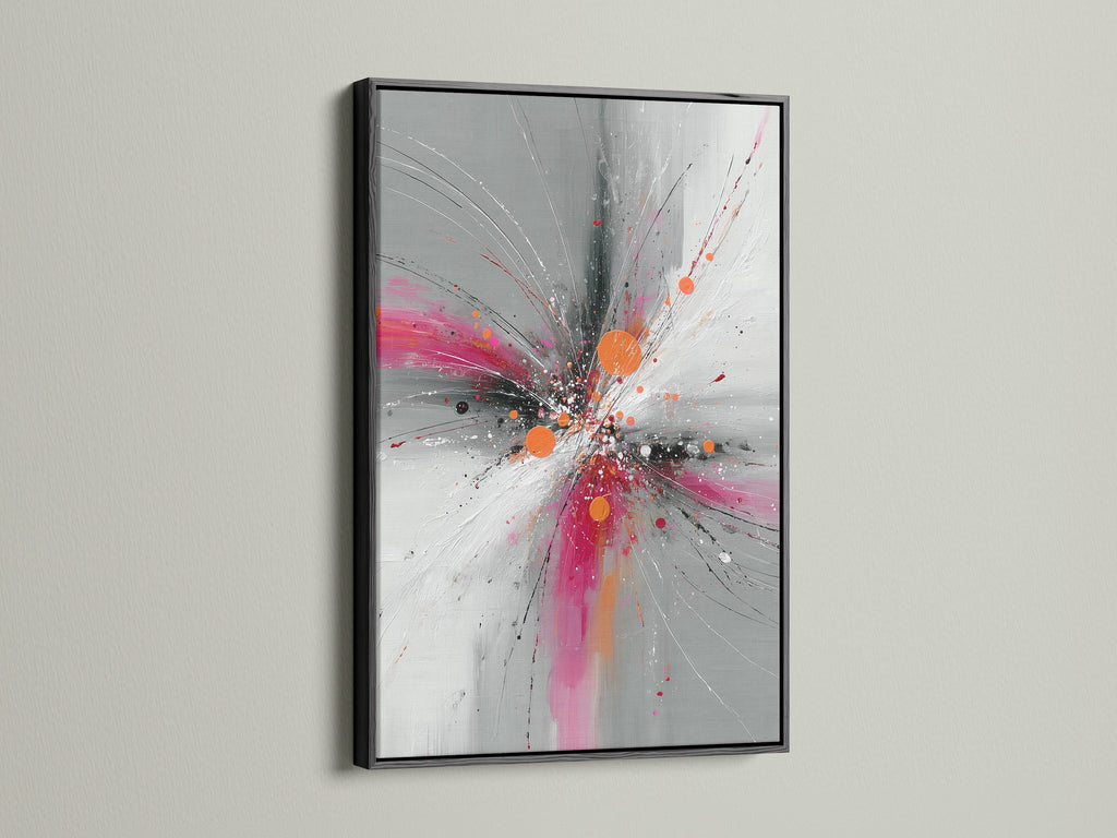 Abstract Burst artwork displayed in a sophisticated black frame. The pink gray and orange colors create a striking explosion print. Enhance your modern decor with this contemporary artwork. Ideal for adding a bold statement to any room. The black frame provides a classic touch.