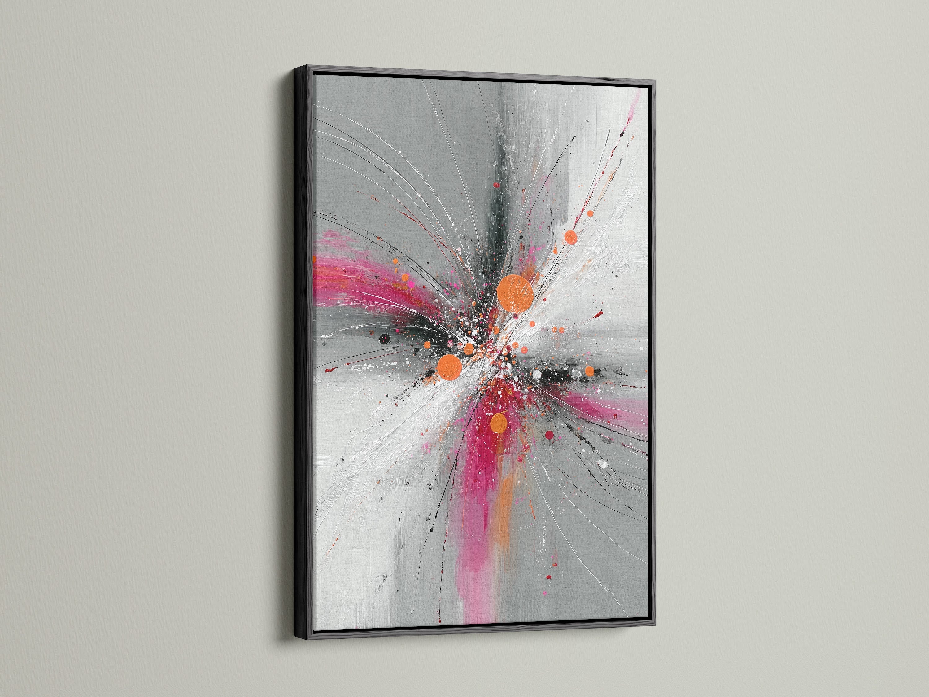 Abstract Burst artwork displayed in a sophisticated black frame. The pink gray and orange colors create a striking explosion print. Enhance your modern decor with this contemporary artwork. Ideal for adding a bold statement to any room. The black frame provides a classic touch.