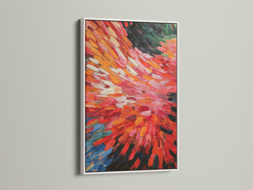 A white frame surrounds a captivating abstract burst artwork. The artwork features vibrant red and orange tones. Its dynamic brushstrokes make it a modern piece. Perfect for adding a pop of color to any room this contemporary print is sure to impress.