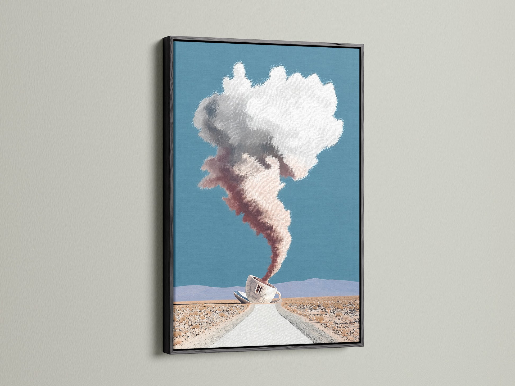 Surreal Coffee Cup Artwork in a Black Frame. It features a desert landscape and dreamy cloudscape. This modern art print is ideal for office wall art. The black frame makes it a unique wall decor piece. Great for modern and eclectic styles.