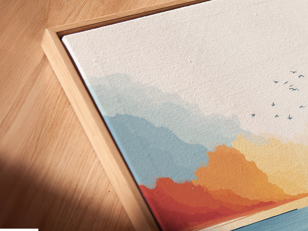 A close-up of a canvas print in a floating frame. The coastal marsh artwork showcases a beautiful sunset seascape. The modern teal and coral colors add depth and dimension. Perfect for a minimalist or Scandinavian interior.
