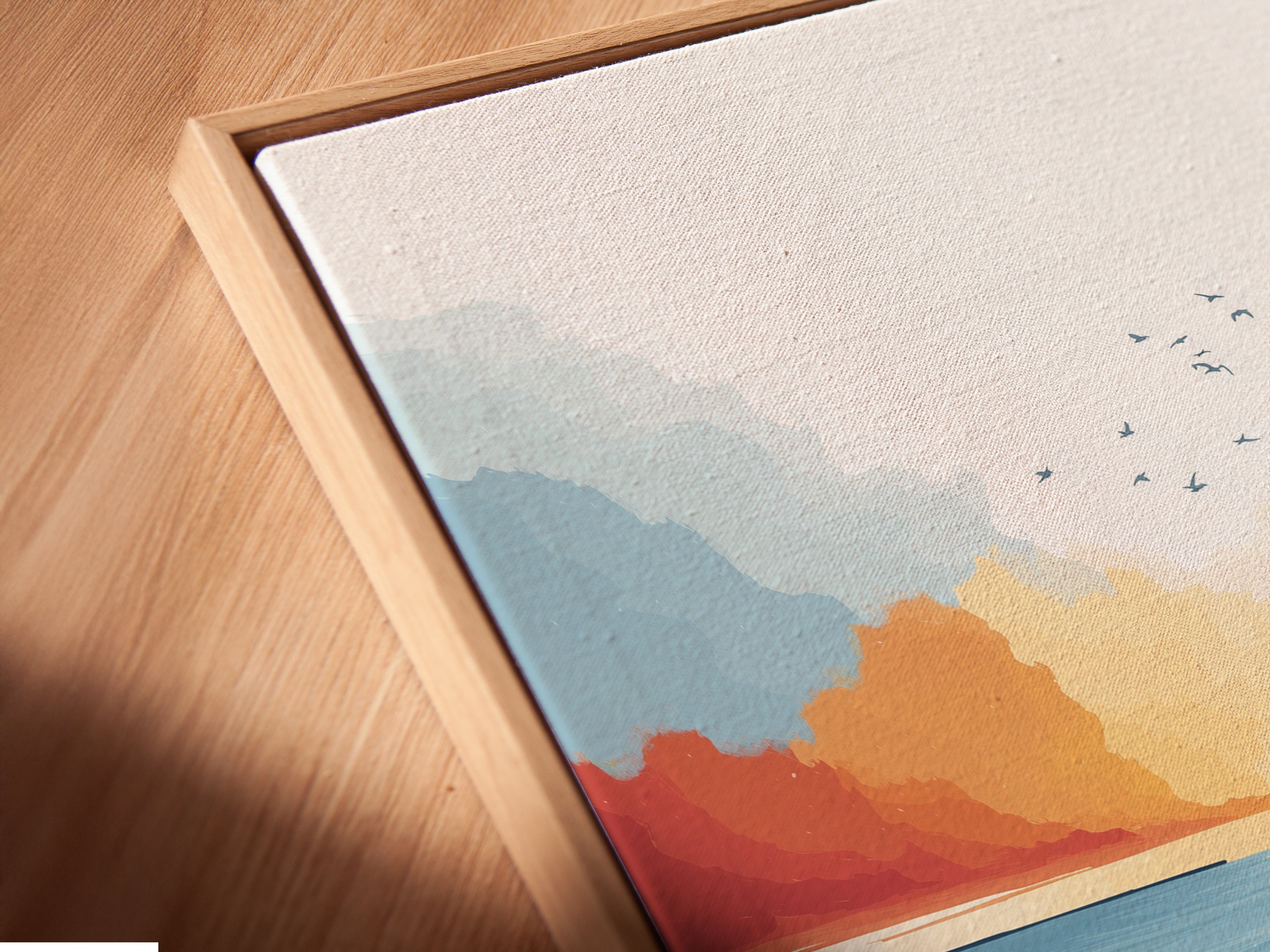 A close-up of a canvas print in a floating frame. The coastal marsh artwork showcases a beautiful sunset seascape. The modern teal and coral colors add depth and dimension. Perfect for a minimalist or Scandinavian interior.