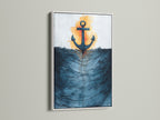 Nautical artwork in a white frame. The art is an anchor and ocean waves. The white frame enhances the navy blue art. Ideal for creating a fresh coastal theme. Discover our selection of coastal prints.