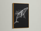 A black and white whale artwork is presented in a luxurious gold frame. This minimalist ocean canvas print adds a touch of elegance. Perfect for enhancing your home office or study. The gold frame highlights the whale artwork. This marine animal art is sure to impress.