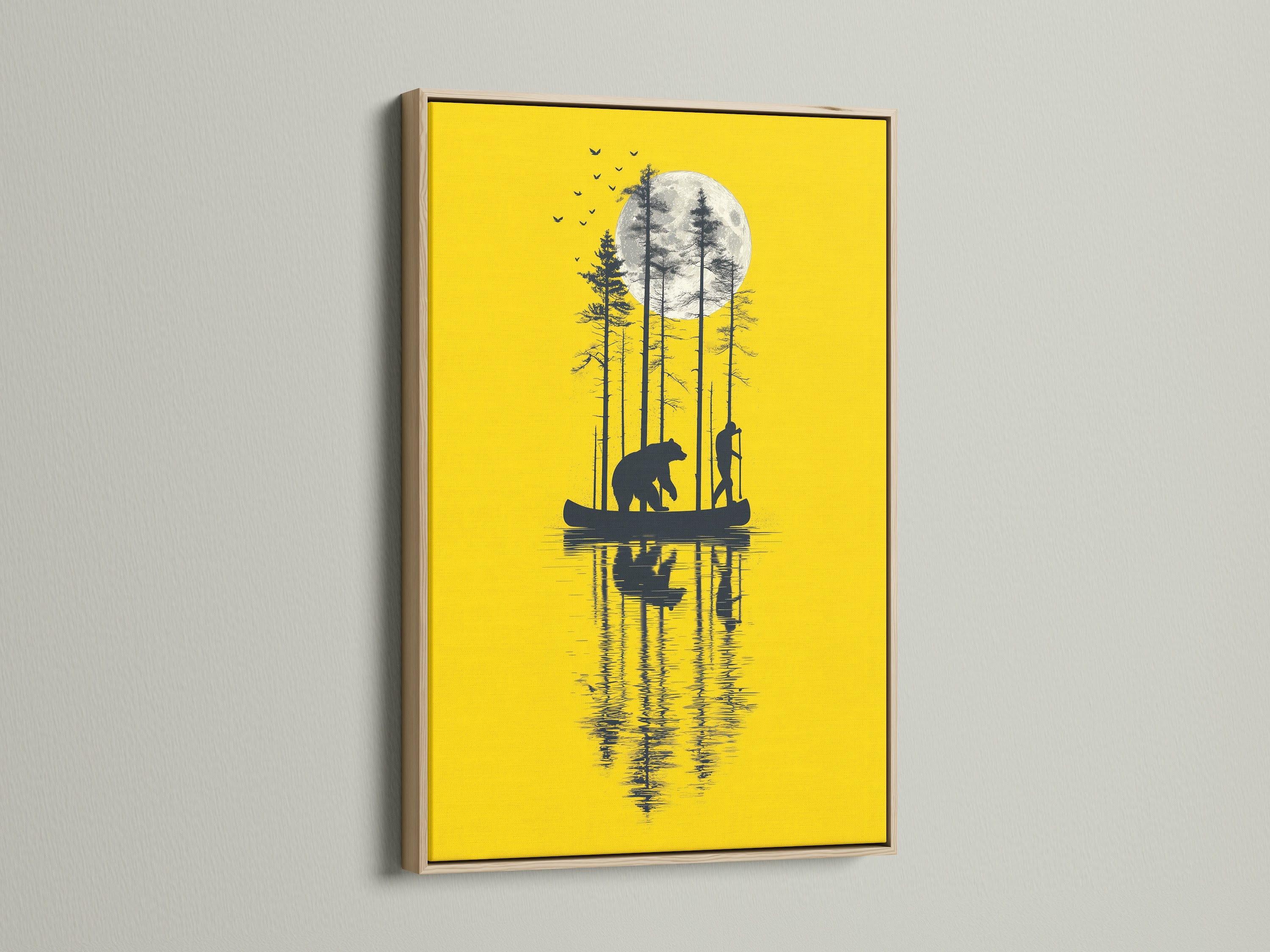 The bear canoe yellow moon artwork is showcased in an oak frame. This nature canvas print brings the outdoors inside. The silhouette art complements cabin wall decor. It is a unique moon art print for lake art enthusiasts. Consider this wildlife art for men.
