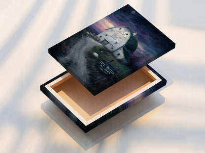 A close up shot of a stretched canvas print. The farmhouse canvas print is stretched and ready to hang. This rustic barn wall art adds charm to any room. Country landscape artwork brings the outdoors in. A perfect piece of kitchen art for your country home.