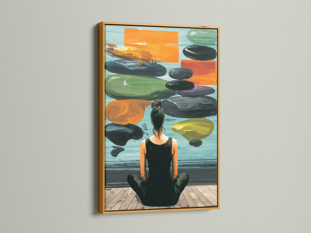 Zen Wall Art in a gold frame is displayed on a white wall. This artwork features a woman meditating. The artwork creates a peaceful atmosphere. Enhance your home with this beautiful art.