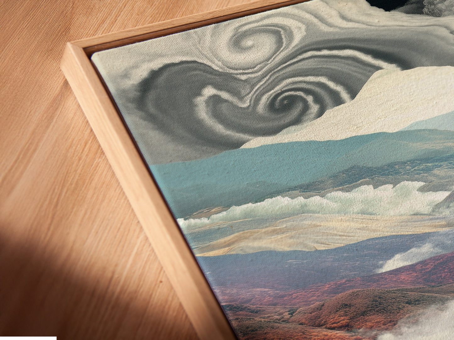 Angled close up of a canvas print in floating frame. This surreal landscape artwork includes dreamy mountains and a checkered path. This unique artwork is perfect for modern spaces. Enhance your wall decor today.