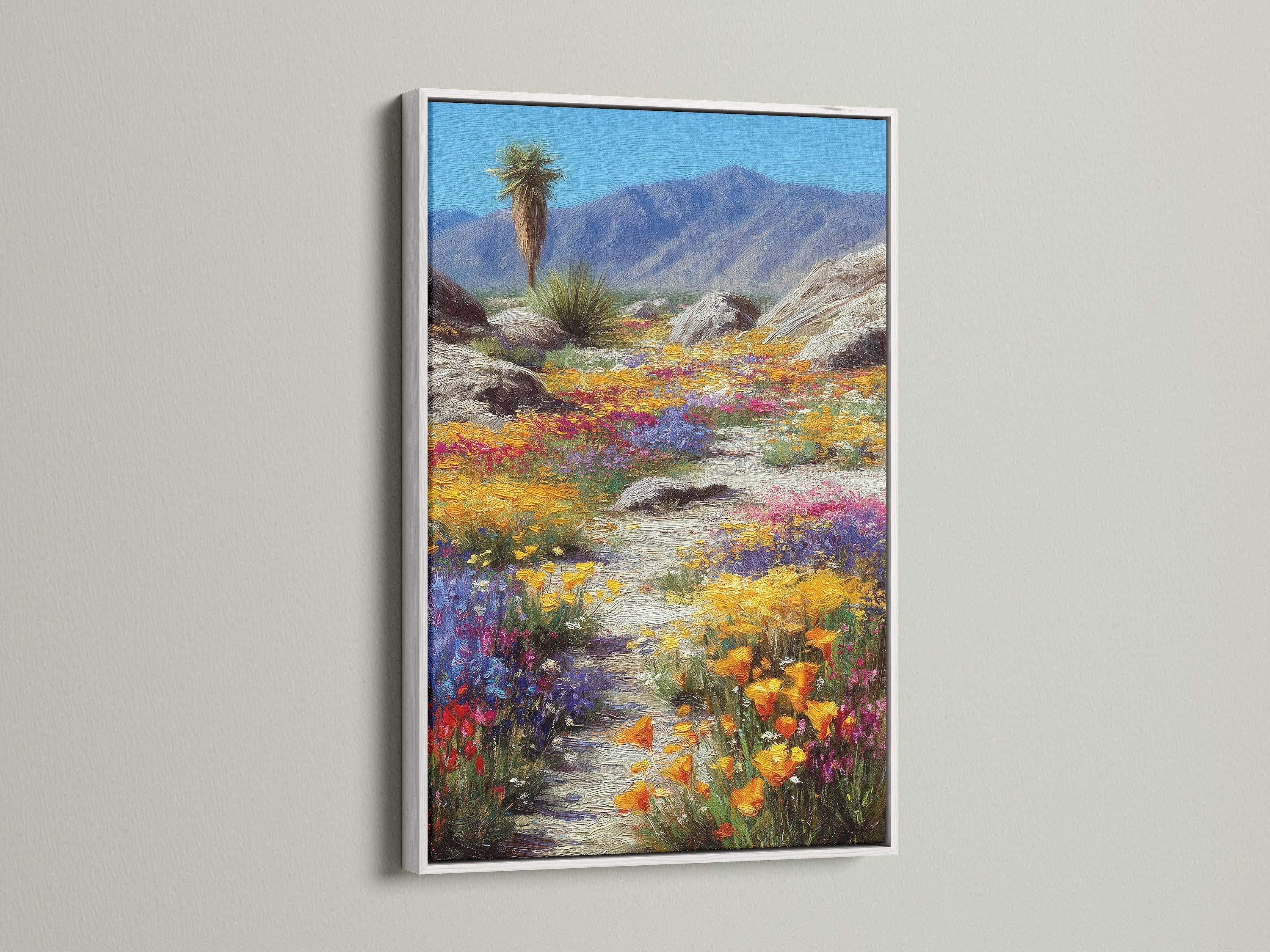 A white frame beautifully complements the desert wildflowers artwork. The colorful landscape print adds a touch of Southwest charm to any room. The white frame enhances the vibrant colors of the nature canvas. This piece brings the desert bloom art indoors.