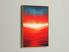 An eye-catching abstract sunset artwork with a red orange mountain landscape is displayed in a gold frame. This modern canvas print adds a touch of luxury. The contemporary print enhances your home decor.