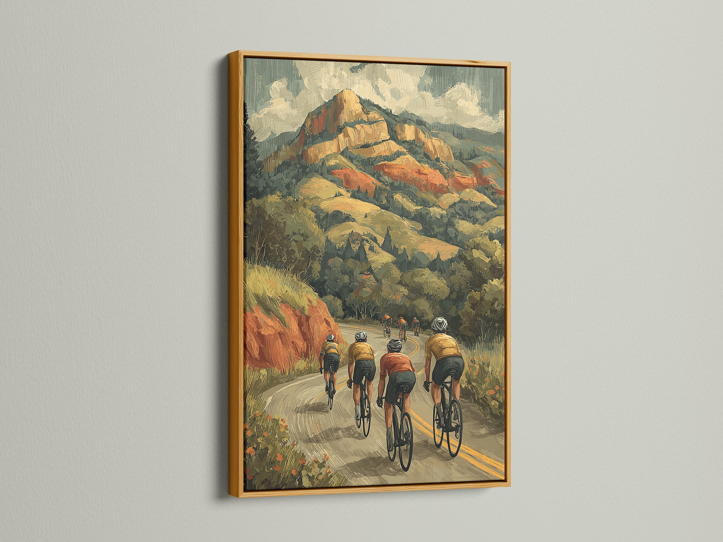Cycling wall art with a gold frame. The artwork portrays cyclists riding through a mountainous landscape. A retro sports canvas art print that adds elegance to any room. Explore our cycling wall art options for your decor