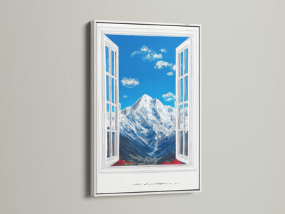 A mountain view artwork is framed in white. The artwork features a bright blue sky with fluffy clouds. A snow-capped mountain is visible through an open window. It's a serene nature artwork. The peaks print adds beauty.