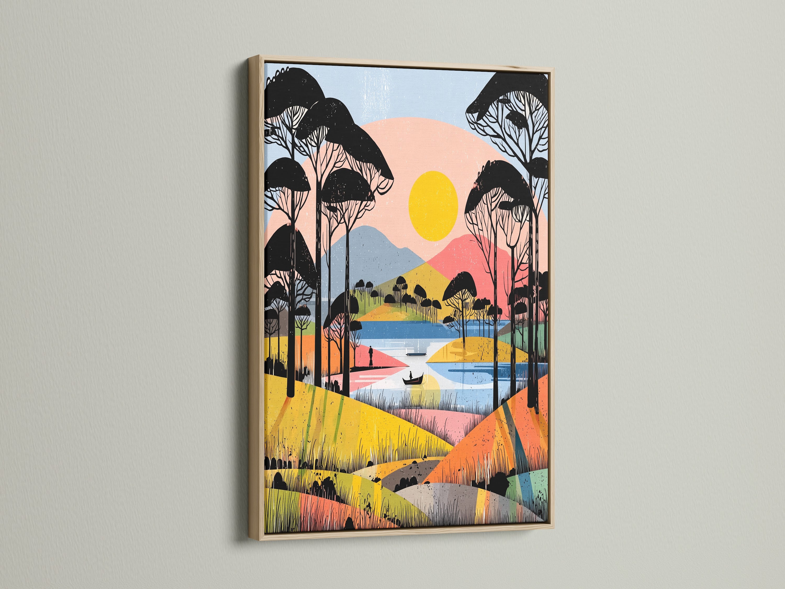 A square landscape canvas print with an oak frame is mounted on a white wall. The abstract artwork shows a lake scene with trees mountains and a yellow sun. The colorful geometric shapes add a modern touch. The oak frame enhances the artwork's natural aesthetic.