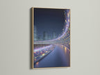 Futuristic cityscape artwork in an oak frame. The modern urban wall art features digital city lights. The oak frame enhances the contemporary style of the artwork. Perfect for adding a touch of modern elegance to your living space.