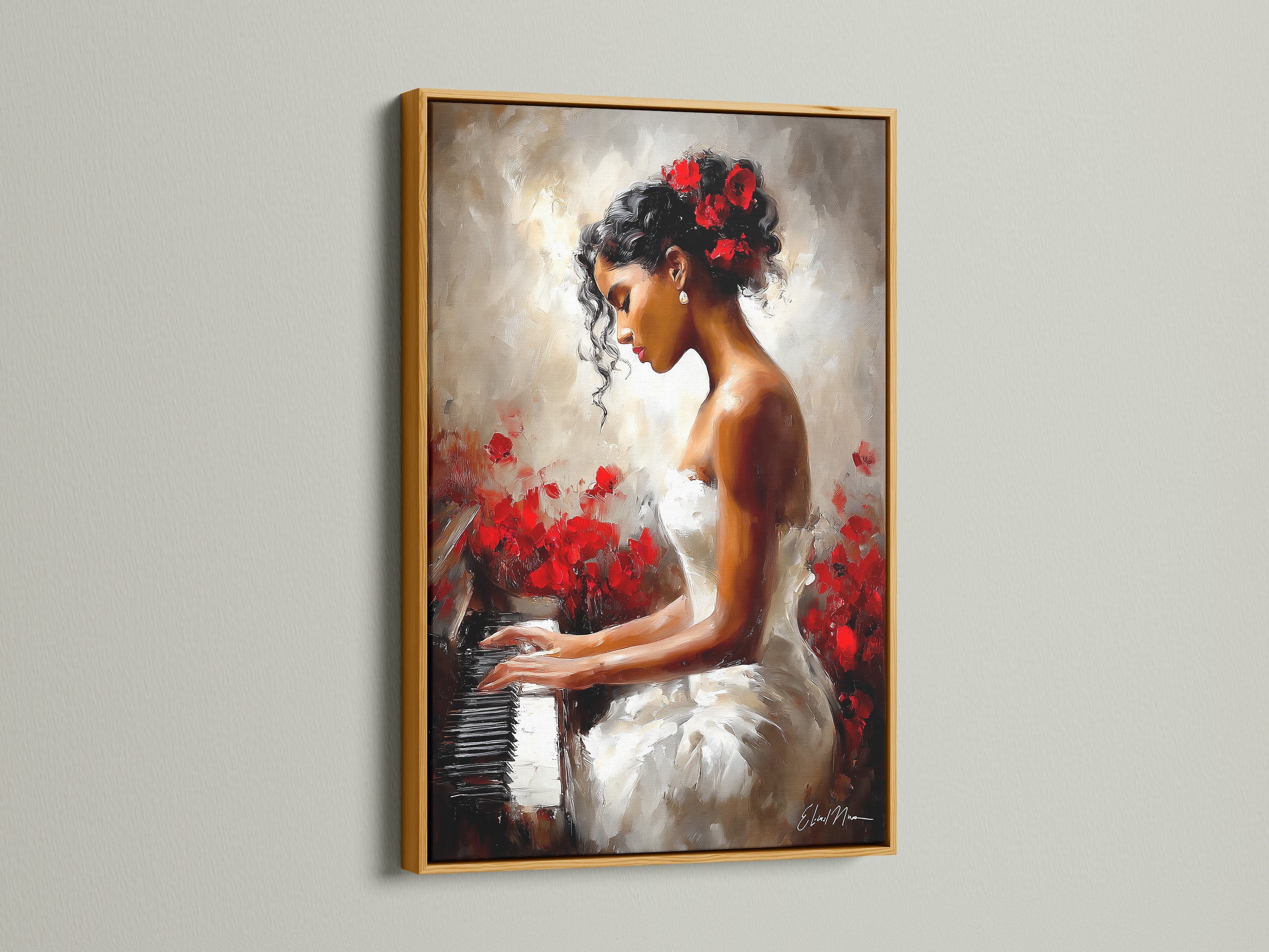 The artwork is framed in gold. It showcases a woman playing the piano. The gold frame adds a luxurious touch. The artwork becomes a focal point. The painting features a woman in a white dress surrounded by red flowers.