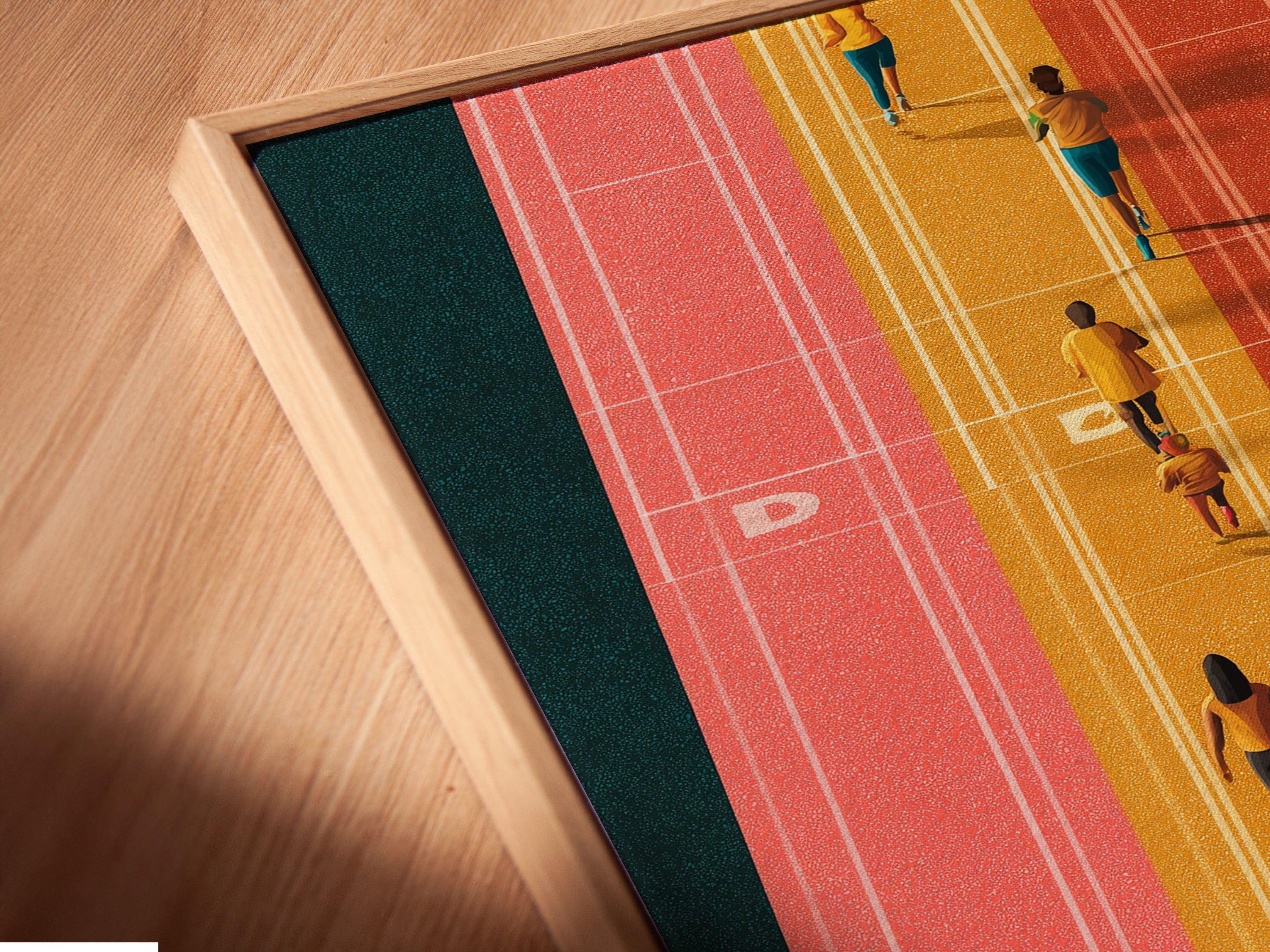 Close-up of a canvas print in a floating frame. The running track artwork brings energy to any room. This aerial sports wall art is perfect for home gym decor. A stylish and motivational piece.