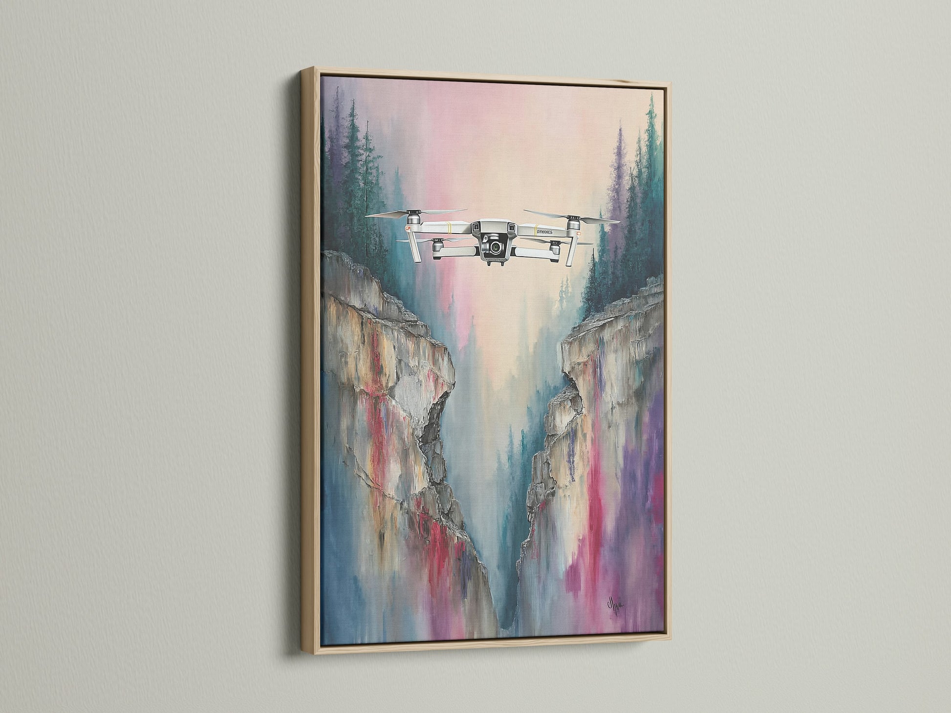 Drone flight artwork with a mountain cliff view. This aerial canvas is framed in oak. It is a beautiful landscape print for modern spaces. The oak frame complements the nature wall art. Elevate your office or home with this unique drone photography.