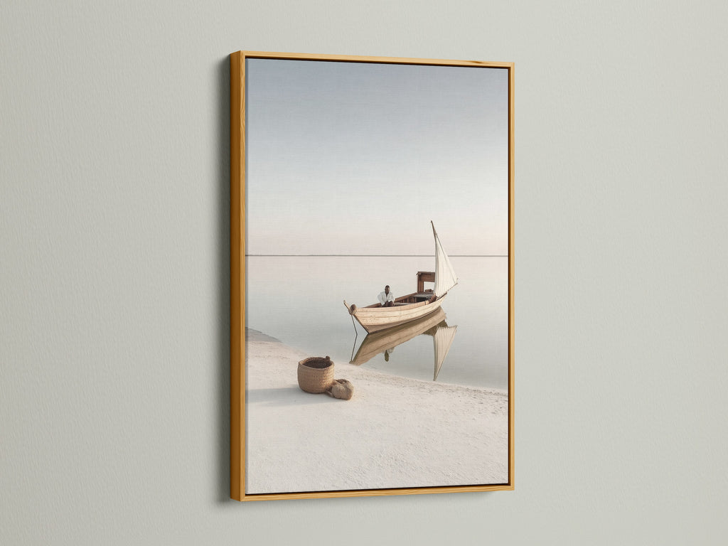 Coastal Artwork in a gold frame. This elegant sailing boat photography adds a touch of luxury to your space. The gold frame enhances the serene ocean view. Perfect for creating a sophisticated coastal theme.