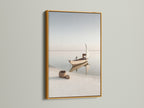 Coastal Artwork in a gold frame. This elegant sailing boat photography adds a touch of luxury to your space. The gold frame enhances the serene ocean view. Perfect for creating a sophisticated coastal theme.