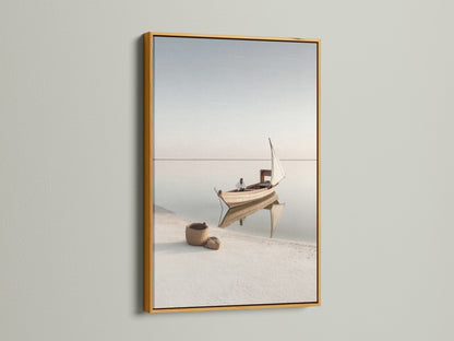 Coastal Artwork in a gold frame. This elegant sailing boat photography adds a touch of luxury to your space. The gold frame enhances the serene ocean view. Perfect for creating a sophisticated coastal theme.