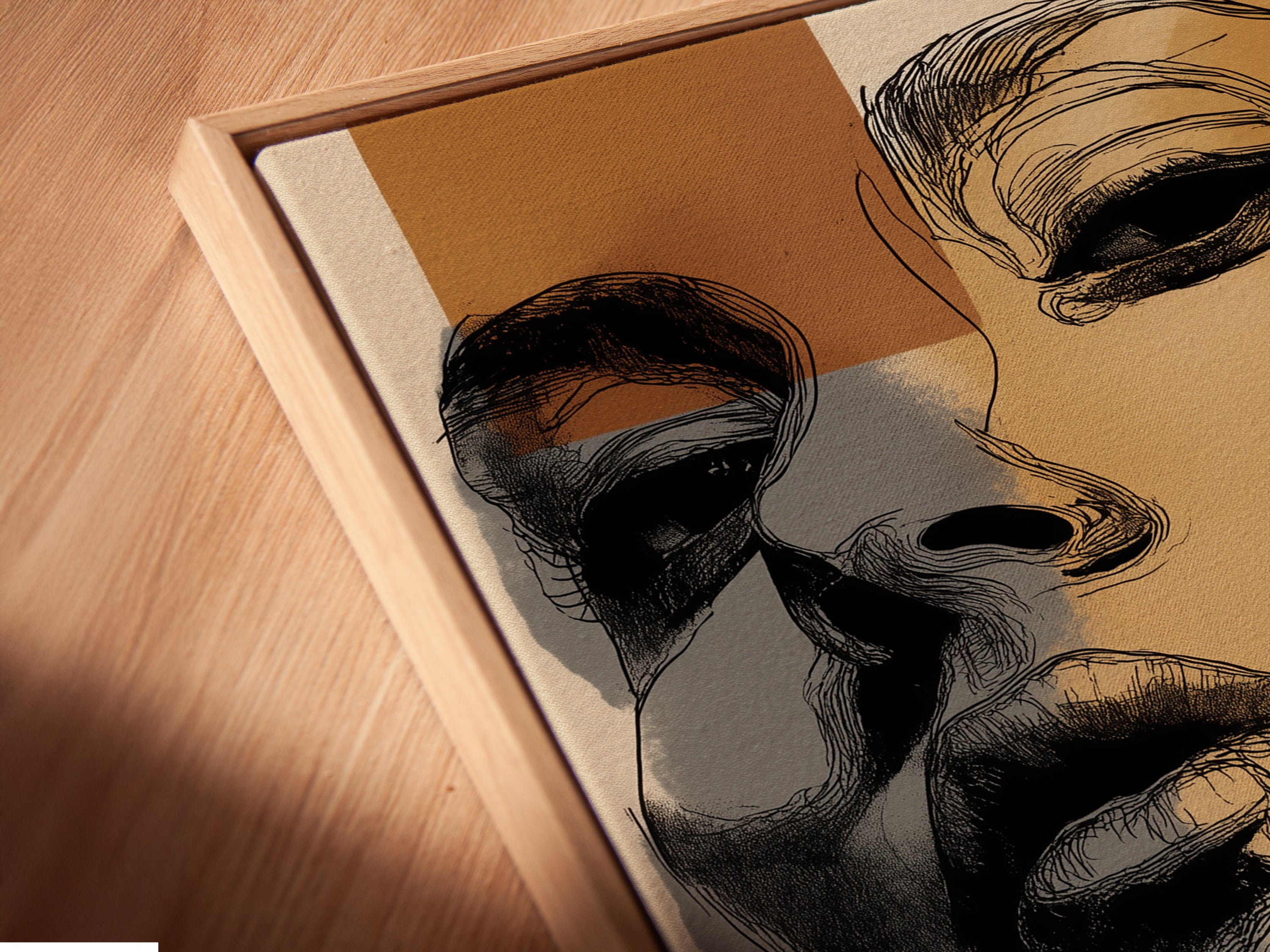 Close-up of a canvas print in a floating frame. The abstract portrait features modern lines and earthy tones. This minimalist face drawing enhances contemporary spaces. A fine art addition.