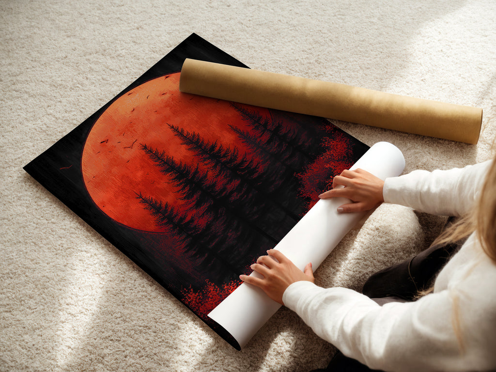 A woman is carefully rolling a fine art poster paper. Preparing a red sunset print of forest moon art. The fine art poster paper ensures high quality reproduction. Perfect for creating stunning wall decor and bringing a moody landscape into your home.