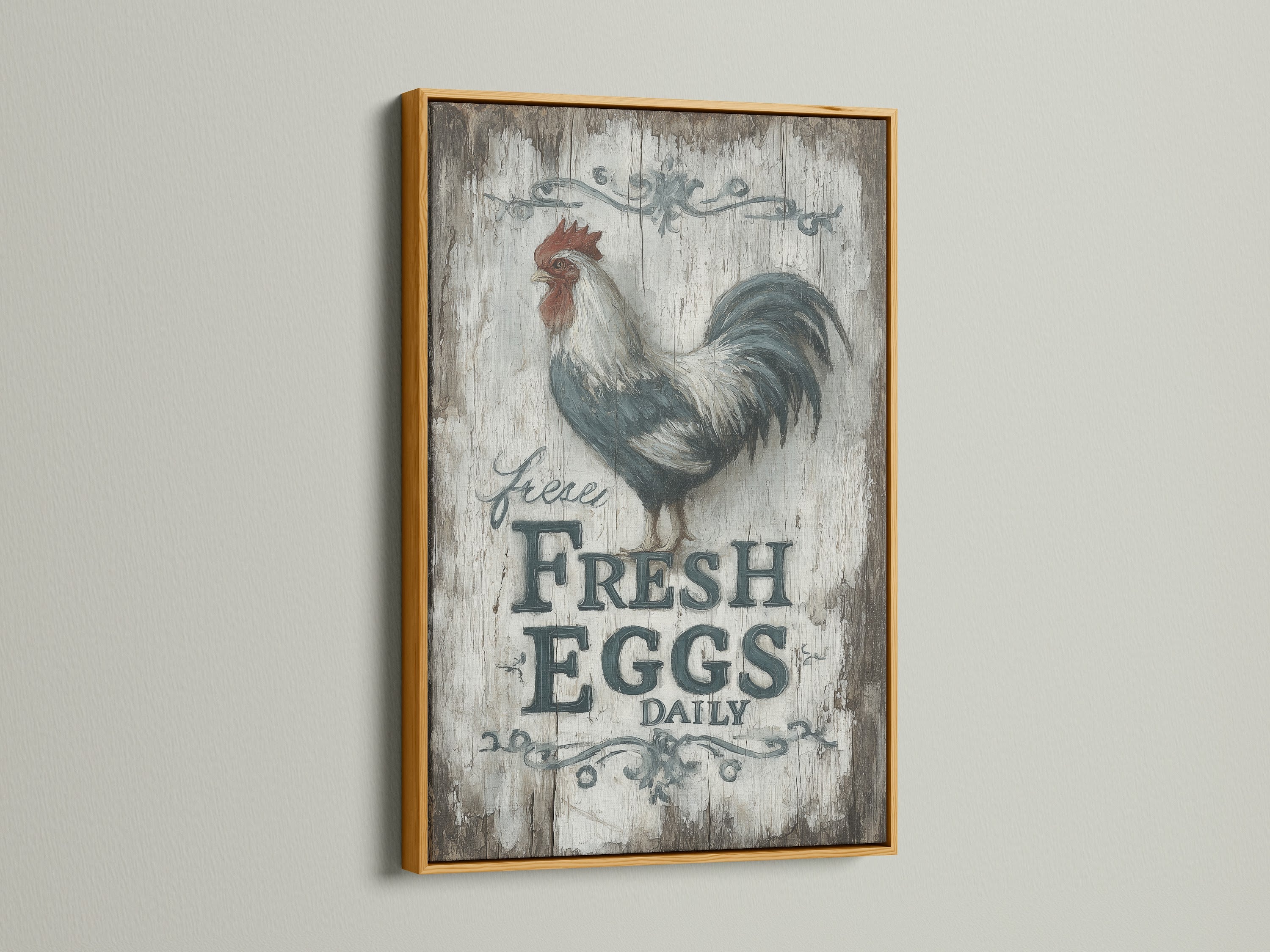 Rooster artwork in a gold frame. This farmhouse kitchen art will bring a vintage feel to your country home. The Fresh Eggs Daily sign adds rustic charm. The gold frame enhances the artwork's presentation. Add a touch of elegance.
