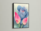 A pink and blue lotus flower artwork in a black frame is mounted on a white wall. Black frames create a bold contrast for modern artwork. Add a touch of elegance to your space with this floral canvas. Shop now for unique wall decor.