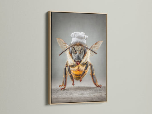 Chef Bee art is displayed in an oak frame. This is quirky kitchen wall art. It's a whimsical bee print for your dining room. Ideal insect artwork for restaurants. The oak frame enhances the piece's rustic charm.