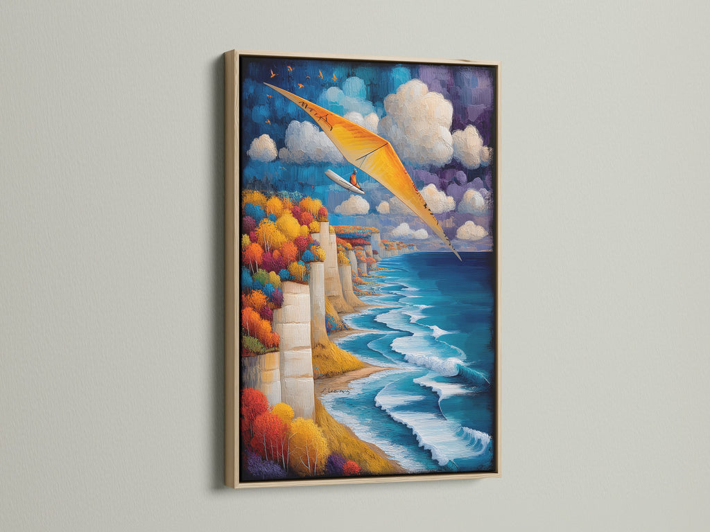Hang gliding artwork in an oak frame. Aviation wall art brings the coast to your home. The art shows a cliffside scenery with a blue ocean and orange hang glider. A perfect adventure print for travel themed spaces. Add coastal landscape to your decor.