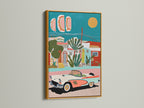 This is a gold framed Mediterranean Village artwork with a vintage car. This coastal artwork features teal and coral decor. The gold frame elevates the retro car art. It is perfect for creating a luxurious and stylish atmosphere.