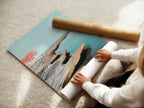 The image shows a woman carefully rolling a fine art poster paper. The paper likely features a coastal seascape artwork. This highlights the care and quality of the fine art printing process. Ideal for those who appreciate serene minimalist artwork. Perfect for decorating your home or office.