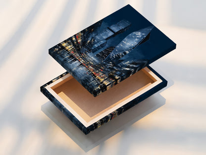 This is a stretched canvas print of a city skyline art. The blue night cityscape wraps around the frame. This modern canvas print is ready to hang. Enjoy a gallery-quality urban wall art piece in your space. Perfect for home or office.