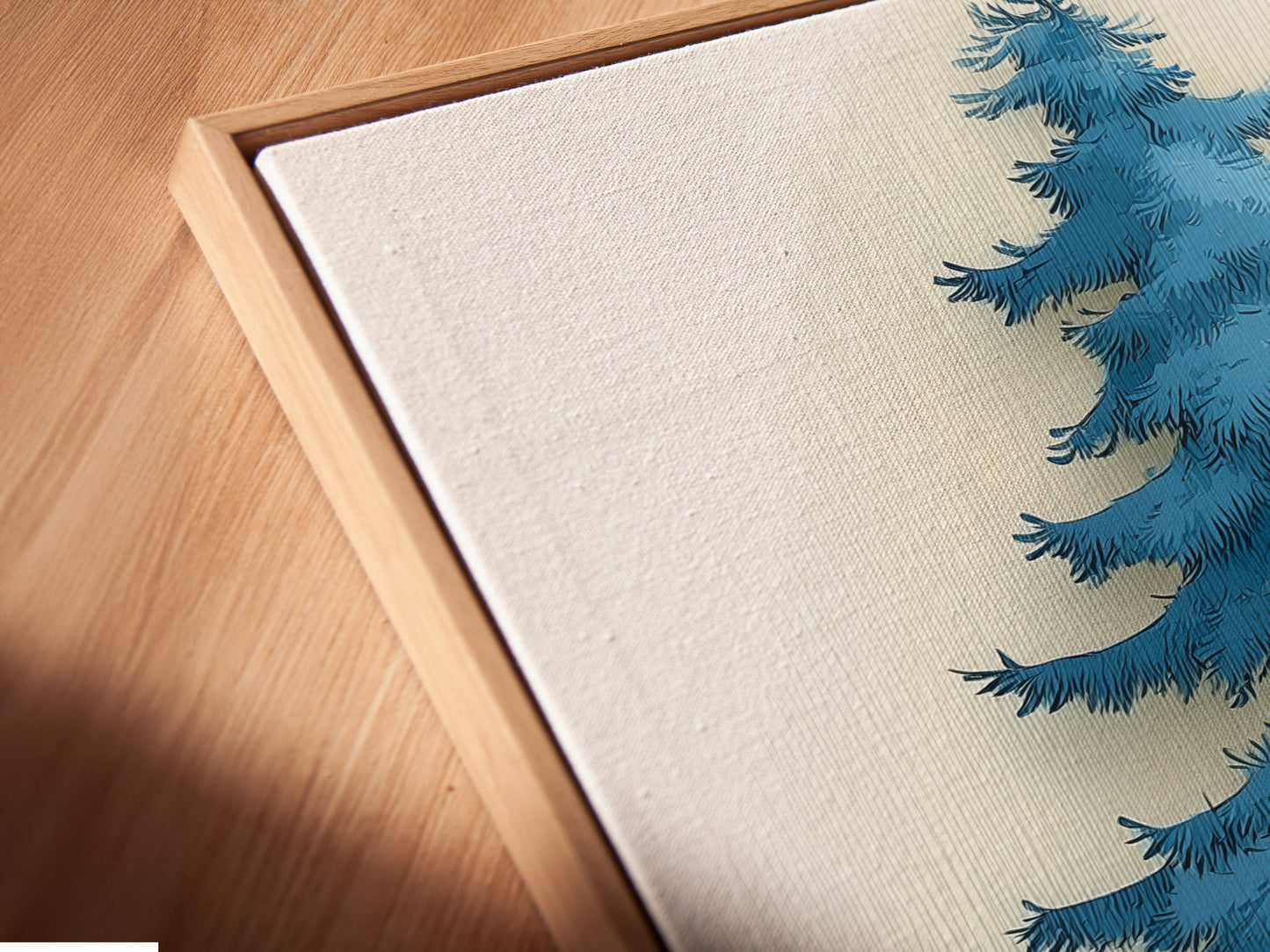 A close-up angled view shows the canvas print in a floating frame. The floating frame gives the artwork a gallery-like appearance. The Blue Forest art looks sophisticated. This modern artwork is ready to hang. The teal and gold colors create a stunning visual. Perfect for adding a touch of elegance to any room. Notice the attention to detail.