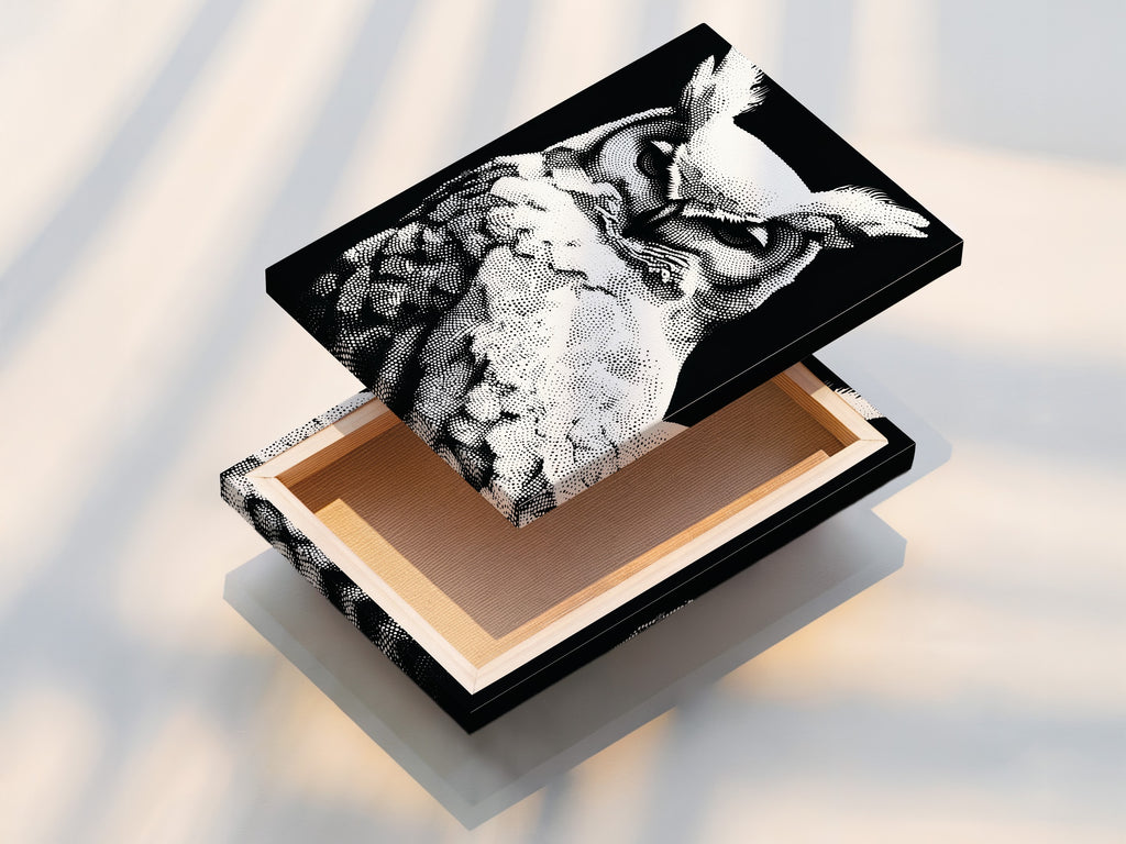 A stretched canvas print of the owl artwork is displayed. The black and white wildlife art is ready to hang. The modern dotted bird canvas is stretched perfectly. Ideal for living rooms bedrooms and offices. It enhances any space with minimalist animal artwork.