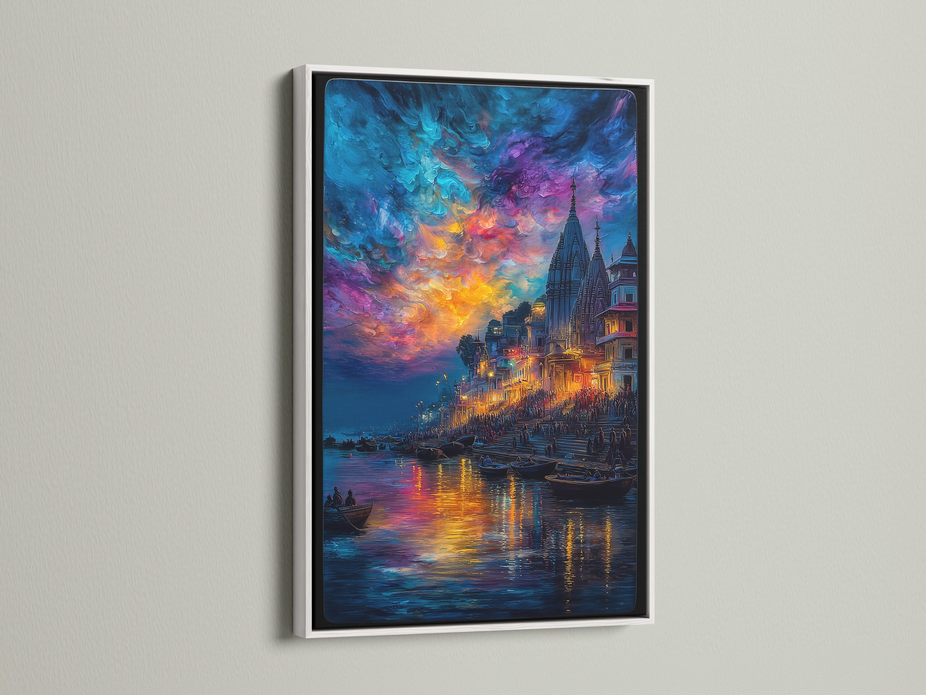 Varanasi River Ghats artwork with a white frame. A stunning sunset canvas reflecting on the Ganges. This Hindu temple art brings spiritual India to your home. Perfect for meditation decor or as a unique piece of India artwork.