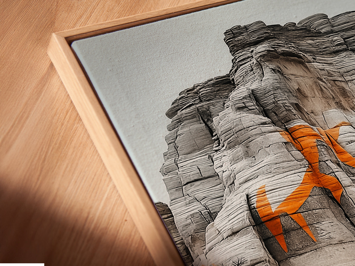 Experience the beauty of desert adventure art. This angled close up shows a canvas print in a floating frame. Ideal motorcycle wall art for man cave decor. Elevate your space with this off road racing artwork. Add a touch of adventure artwork to your office or studio with this desert landscape motorcycle print.
