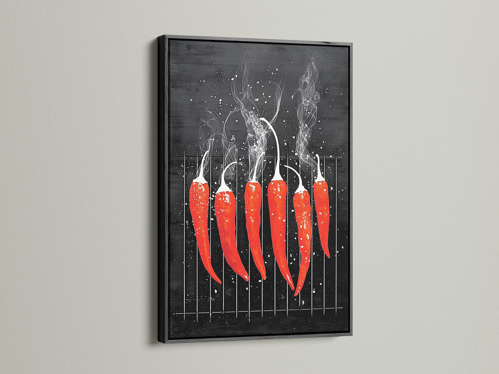A red hot chili pepper artwork is framed in black. The art is displayed on a clean white wall. The artwork adds a bold and modern touch to culinary spaces. Perfect as restaurant art or spicy food decor. It is ideal for those seeking minimalist artwork.