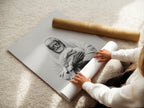 A woman is carefully rolling a fine art poster paper. The paper looks smooth and high-quality. She handles the artwork with care. The fine art poster paper is ready for framing or display. This paper ensures the artwork looks its best.