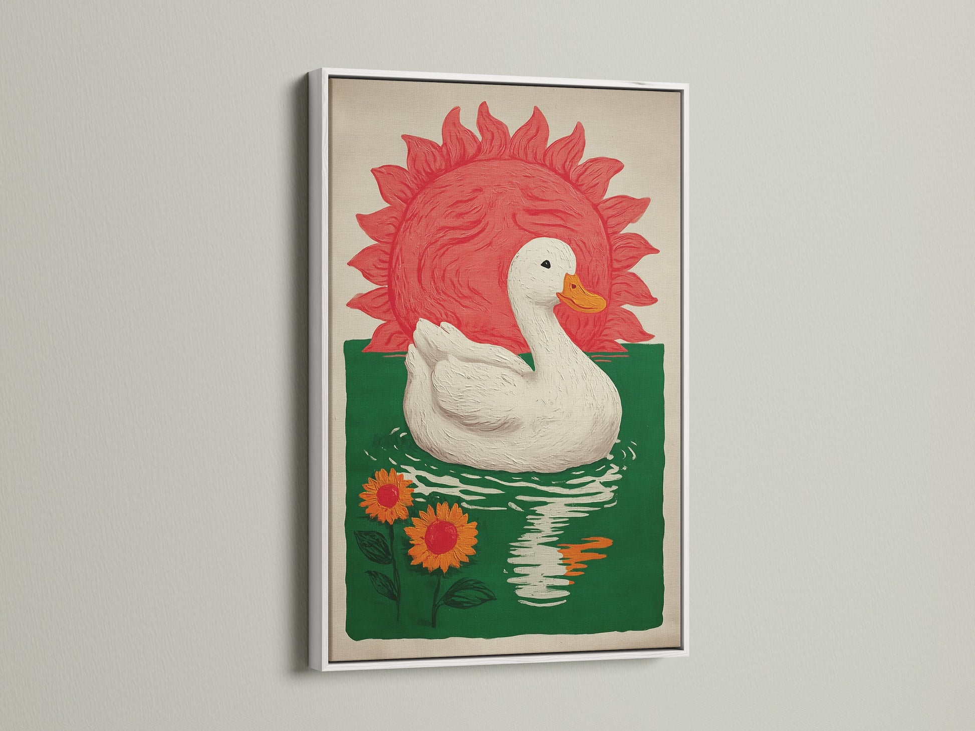 Bohemian Style Wall Art in a white frame. The art features a white duck floating on green water with orange sunflowers. A red sun is in the background. This sunflower print would be great for a dining area. Consider this sun artwork for farmhouse rustic or eclectic styles.