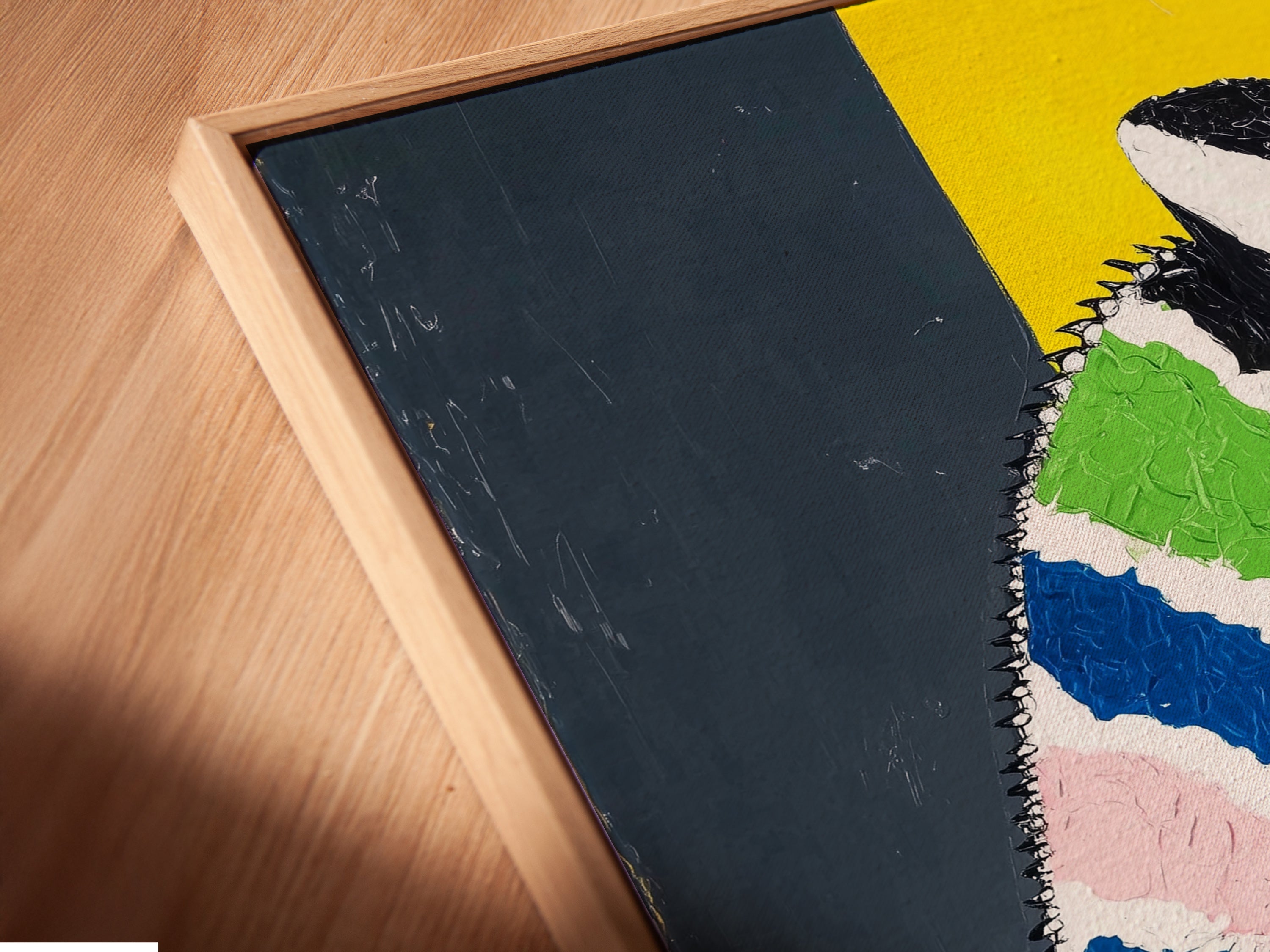 Close up angled view of a canvas print in a floating frame. The colorful chameleon art looks great. This artwork adds a modern touch. Perfect for any eclectic space. It makes a statement.