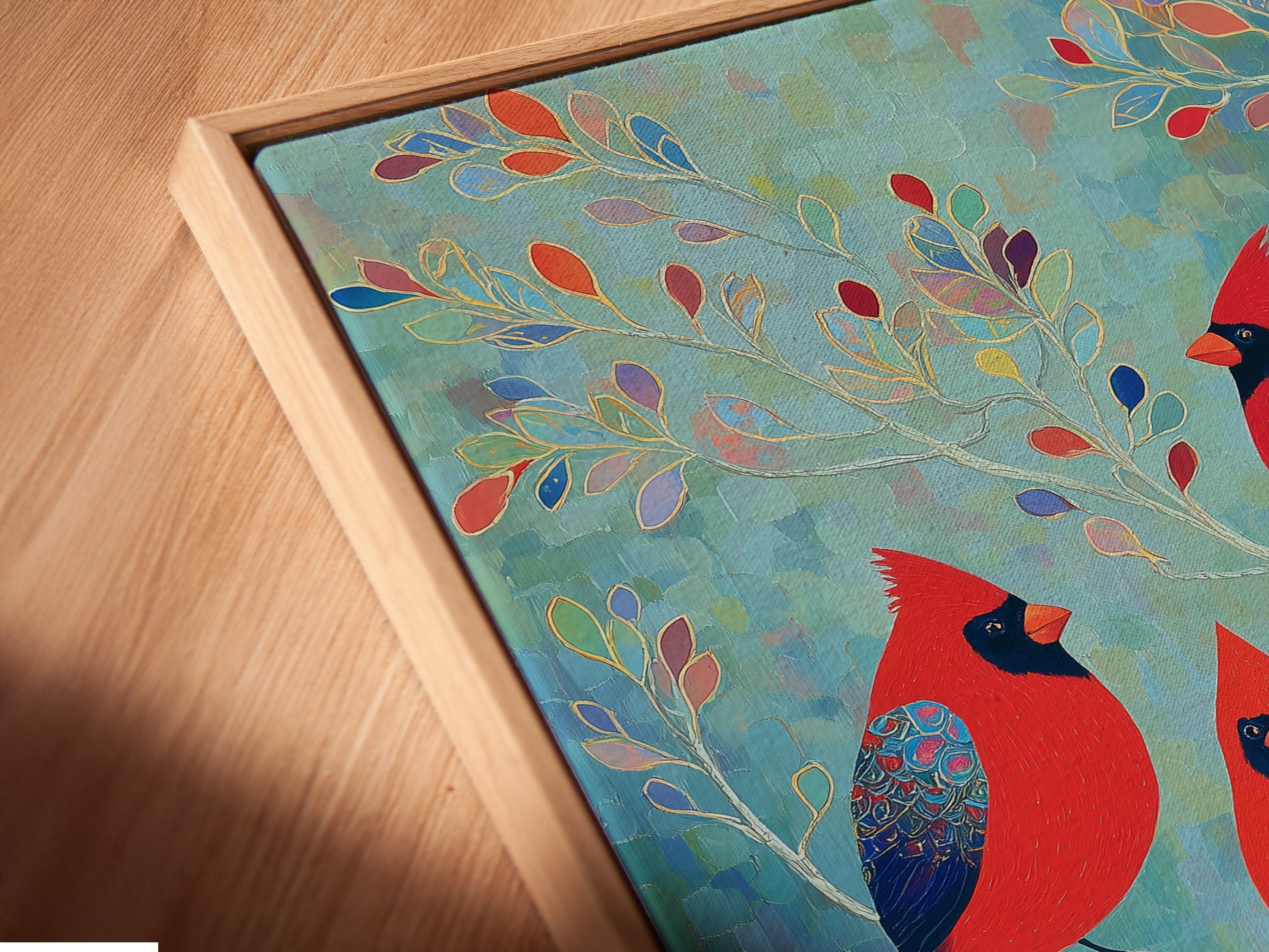 An angled close up view of the Cardinal Birds canvas print in a floating frame. This modern presentation elevates the artwork. The nature lover gift is ready to hang. Enjoy this beautiful bird canvas print.