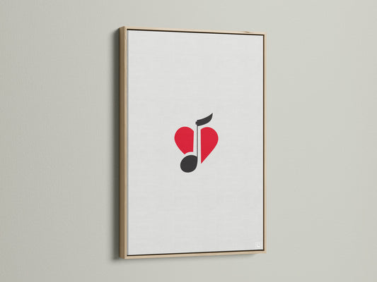 This music-themed artwork features a red heart and black music note. The artwork is framed in oak. It's ideal for a music lover gift.  Enhance your studio wall decor with this minimalist piece.