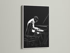 Discover the beauty of this piano player artwork. The jazz musician canvas wall art is showcased in a white frame. Brighten up your interior with black and white music wall decor. Ideal for living rooms or offices.