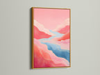 This gold frame enhances the pink abstract art. Imagine this mountain canvas in a modern home. The flowing river art offers a touch of elegance to your boutique wall art. Elevate your space today.