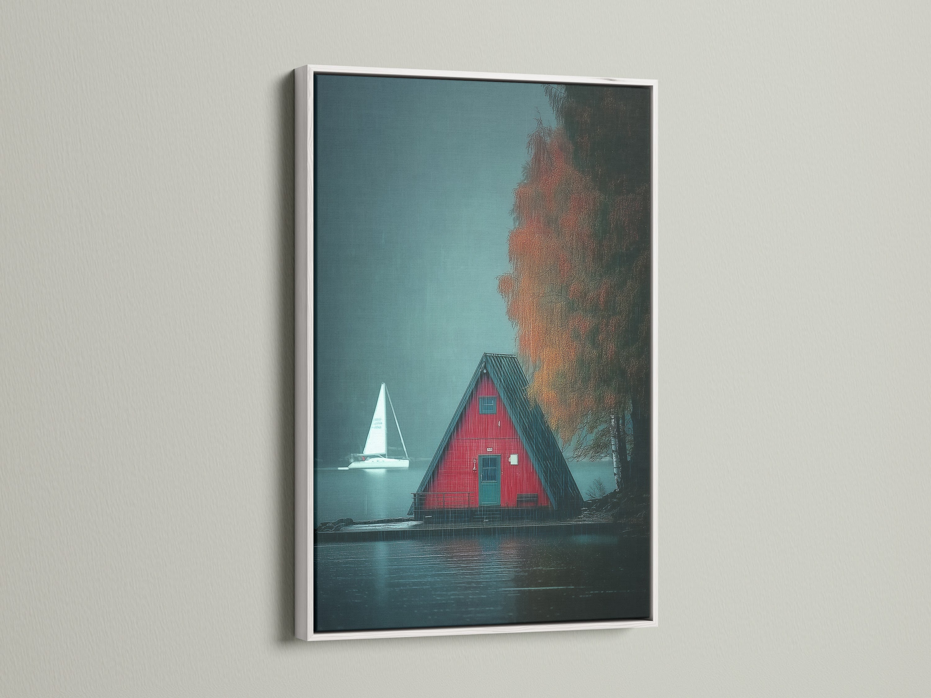A-Frame Cabin Canvas artwork with a white frame is presented. The artwork showcases a moody lake landscape perfect for cottagecore decor. This red house wall art adds a touch of Scandinavian style. Enhances any living room or bedroom. Ideal for those who love nature-inspired decor and cozy home aesthetics.