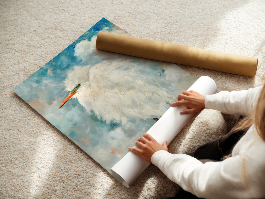 A woman rolls fine art poster paper. She is preparing a Heron bird painting print. Experience the quality of our coastal wall art. Get your serene art ready for display