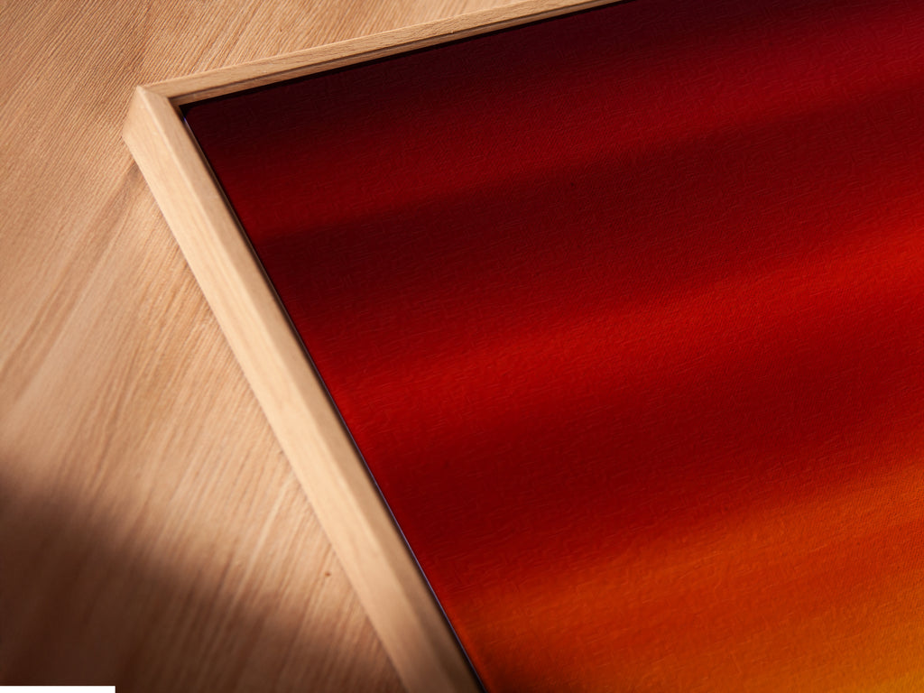 Close-up of a canvas print in a floating frame. The artwork is a forest sunset scene with warm tones. The floating frame adds a modern touch to the rustic nature artwork. Perfect for showcasing pine tree art in living rooms or bedrooms. Enhance your wall decor with this elegant piece.